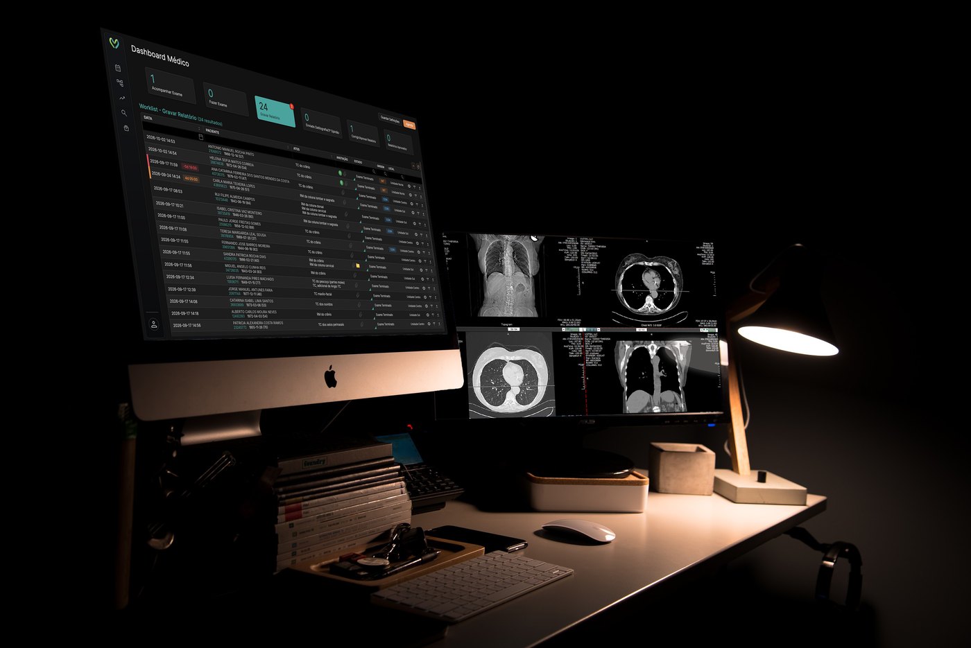 Radiologist's desk at night: the VIDAcare physician worklist on an iMac, next to a monitor with CT images